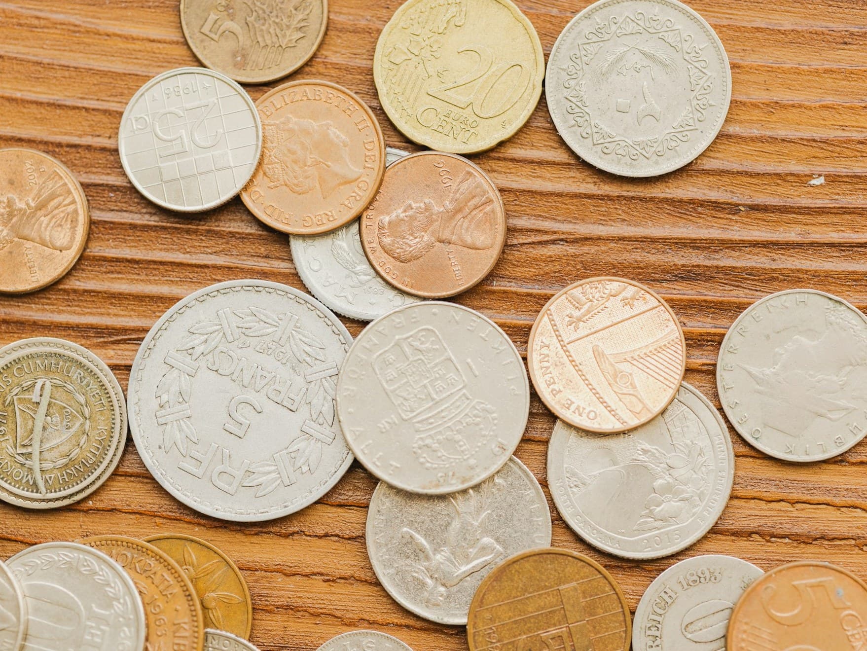 A varied collection of rare coins arranged for appraisal — the kind of holdings Park Avenue’s specialists evaluate in private at our Miami office